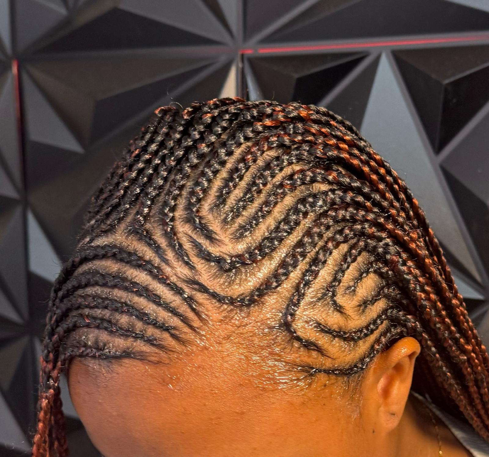 Tribal heart cornrow design at Braids by estal