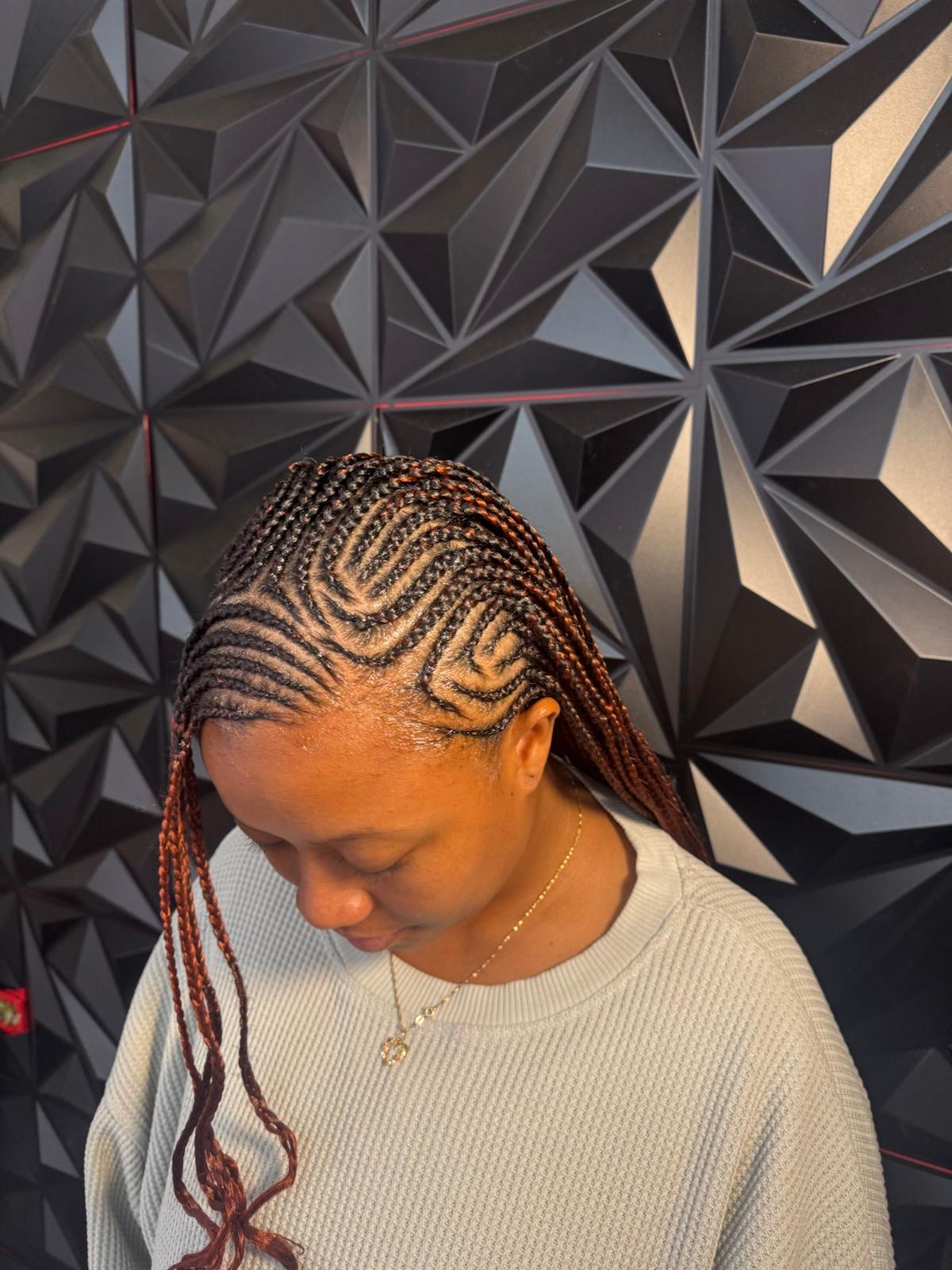 Tribal cornrow curl pattern at Braids by estal